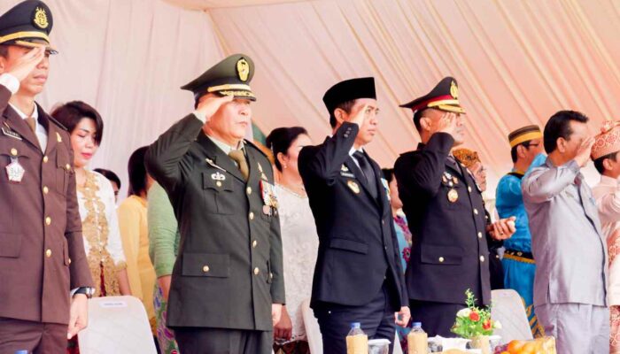 Bupati Bersama Ketua TP-PKK Boltim Hadiri Prosesi Upacara HUT Bhayangkara Ke-76