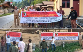 Laskar Bogani Pajang Baliho Perusahaan Pembawa Bencana di Panang