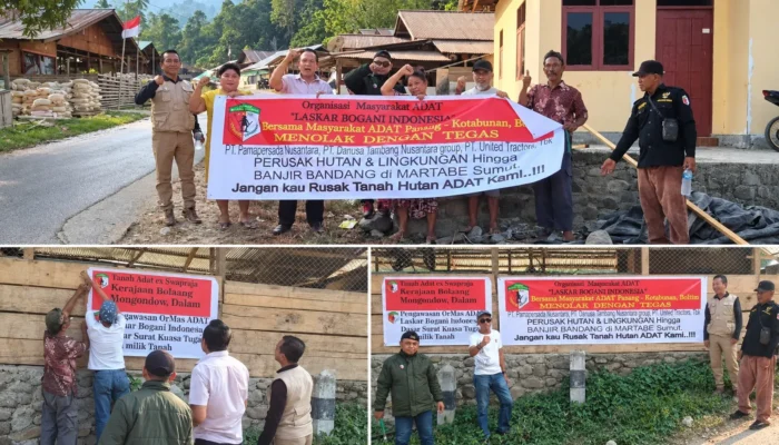 Laskar Bogani Pajang Baliho Perusahaan Pembawa Bencana di Panang